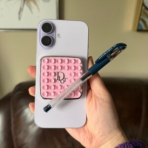 Dior pink phone ring accessory